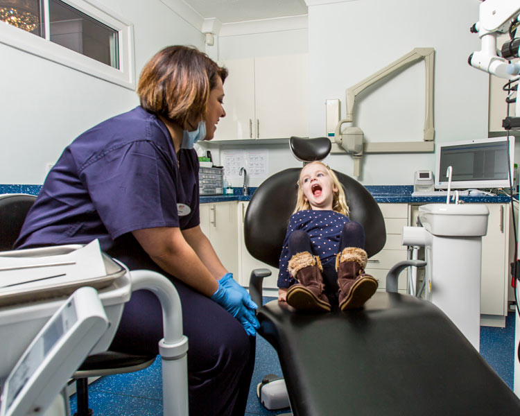 girl in dentist with dentist
